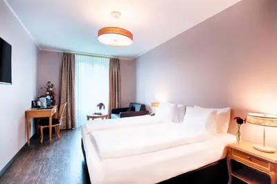 Ein Bett oder Betten in einem Zimmer der Unterkunft Grand Hotel Beau Rivage Interlaken
