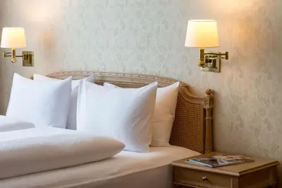 Ein Bett oder Betten in einem Zimmer der Unterkunft Grand Hotel Beau Rivage Interlaken
