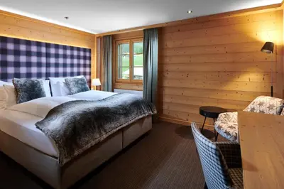 Ein Bett oder Betten in einem Zimmer der Unterkunft Aspen Alpine Lifestyle Hotel