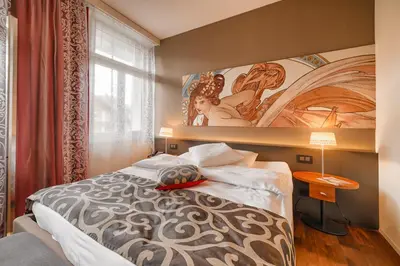 Ein Bett oder Betten in einem Zimmer der Unterkunft Belvédère Strandhotel