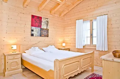Ein Bett oder Betten in einem Zimmer der Unterkunft Apartment St. Louis 3.5 - GriwaRent AG
