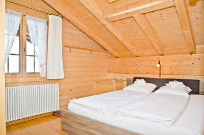 Ein Bett oder Betten in einem Zimmer der Unterkunft Apartment St. Louis 3.5 - GriwaRent AG