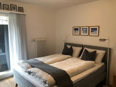 Ein Bett oder Betten in einem Zimmer der Unterkunft Wohnung Haus St. Martin