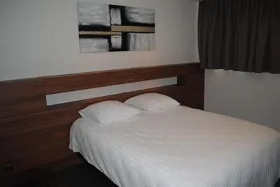 Ein Bett oder Betten in einem Zimmer der Unterkunft Hotel Du Soleil