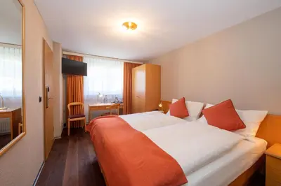 Ein Bett oder Betten in einem Zimmer der Unterkunft Hotel Alex Business & SPA