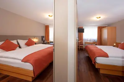 Ein Bett oder Betten in einem Zimmer der Unterkunft Hotel Alex Business & SPA