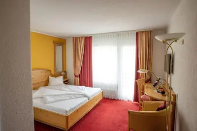 Ein Bett oder Betten in einem Zimmer der Unterkunft Genusshotel Brienz