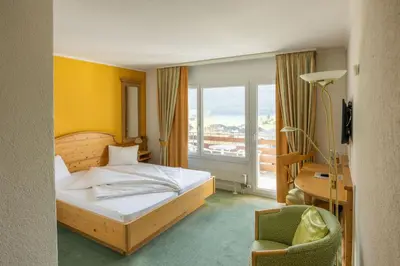 Ein Bett oder Betten in einem Zimmer der Unterkunft Genusshotel Brienz