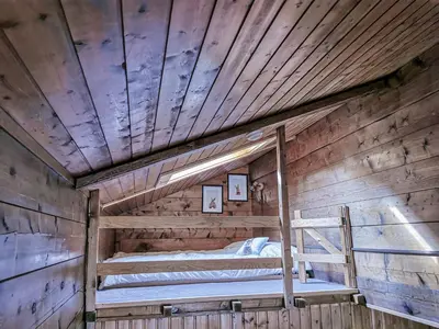Ein Etagenbett oder Etagenbetten in einem Zimmer der Unterkunft Relais des Mélèzes