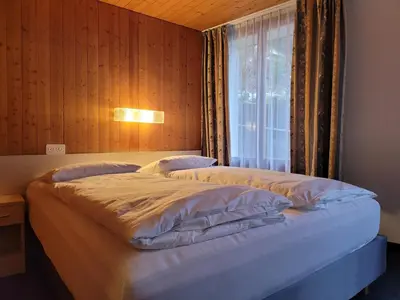 Ein Bett oder Betten in einem Zimmer der Unterkunft Dinh Residence