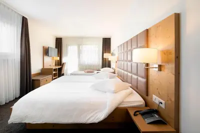 Ein Bett oder Betten in einem Zimmer der Unterkunft Hotel Olympic - Montana Center