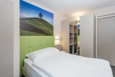 Ein Bett oder Betten in einem Zimmer der Unterkunft Adhhoc Hotel
