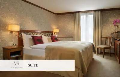 Ein Bett oder Betten in einem Zimmer der Unterkunft Monte Rosa Boutique Hotel