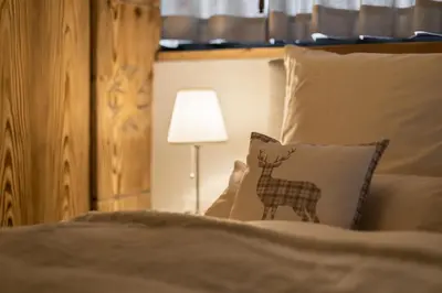 Ein Bett oder Betten in einem Zimmer der Unterkunft Villa Alpenhof