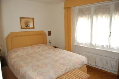 Ein Bett oder Betten in einem Zimmer der Unterkunft CRANS MONTANA LE REGENT APPARTEMENT