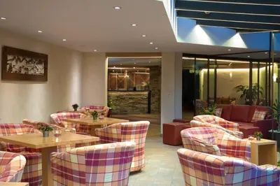 Ein Sitzbereich in der Unterkunft Hotel Helvetia Intergolf