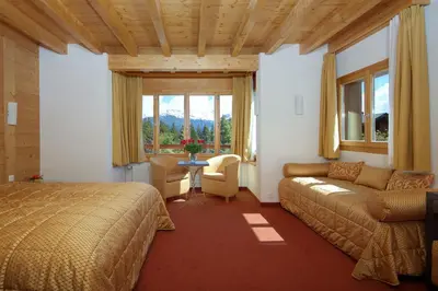 Ein Bett oder Betten in einem Zimmer der Unterkunft Hotel La Prairie