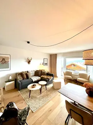 Ein Sitzbereich in der Unterkunft Window on Crans Montana, Appartement avec vue sur les Alpes