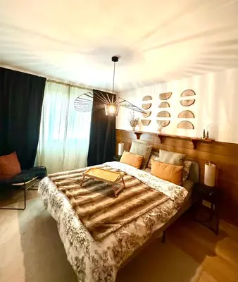 Ein Bett oder Betten in einem Zimmer der Unterkunft Window on Crans Montana, Appartement avec vue sur les Alpes