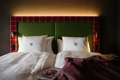 Ein Bett oder Betten in einem Zimmer der Unterkunft Bergwelt Grindelwald - Alpine Design Resort