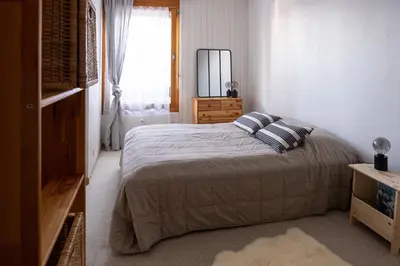 Ein Bett oder Betten in einem Zimmer der Unterkunft Anzère - Appartement 2 pièces au pied du télécabine