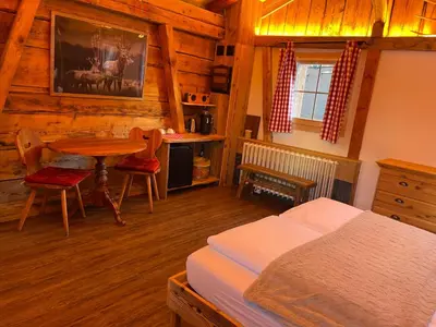 Ein Bett oder Betten in einem Zimmer der Unterkunft Hotel Jägerstübli Grindelwald