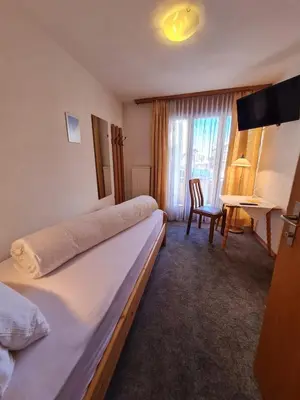 Ein Bett oder Betten in einem Zimmer der Unterkunft Hotel Restaurant Krone