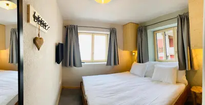 Ein Bett oder Betten in einem Zimmer der Unterkunft Chalet Bergheimat Zermatt