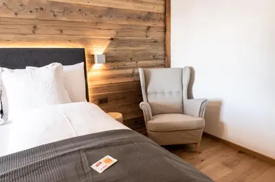 Ein Bett oder Betten in einem Zimmer der Unterkunft Typically Swiss Hotel Ermitage