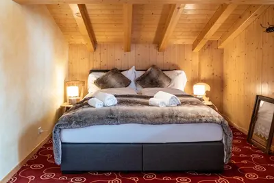Ein Bett oder Betten in einem Zimmer der Unterkunft Typically Swiss Hotel Ermitage