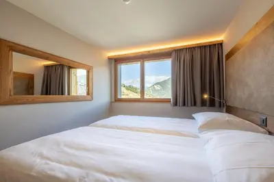 Ein Bett oder Betten in einem Zimmer der Unterkunft SWISSPEAK Resorts by Pierre & Vacances Premium Vercorin