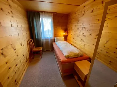 Ein Bett oder Betten in einem Zimmer der Unterkunft Apartment Chalet Jungtalblick Eggeri by Interhome