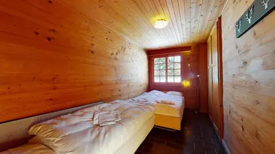 Ein Bett oder Betten in einem Zimmer der Unterkunft Apartment at the bottom of the slopes in Crans-Montana, cosy atmosphere