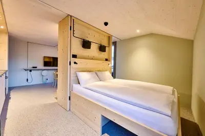 Ein Bett oder Betten in einem Zimmer der Unterkunft Apart Hotel Adelboden am Dorfplatz