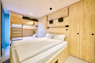 Ein Bett oder Betten in einem Zimmer der Unterkunft Apart Hotel Adelboden am Dorfplatz