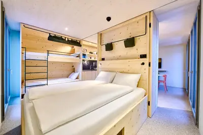 Ein Bett oder Betten in einem Zimmer der Unterkunft Apart Hotel Adelboden am Dorfplatz