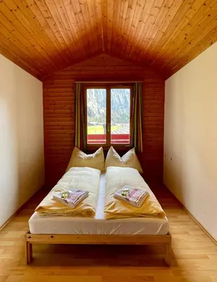 Ein Bett oder Betten in einem Zimmer der Unterkunft Alpine Base Hostel - Adults only