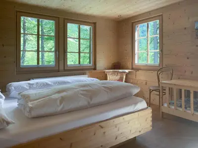Ein Bett oder Betten in einem Zimmer der Unterkunft Hotel Fafleralp