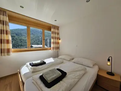 Ein Bett oder Betten in einem Zimmer der Unterkunft Aramis Lodge