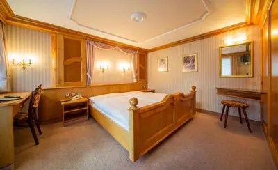 Ein Bett oder Betten in einem Zimmer der Unterkunft Hotel Olympia
