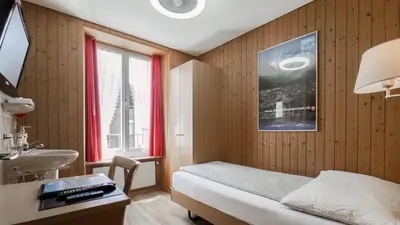 Ein Bett oder Betten in einem Zimmer der Unterkunft Hotel Rössli