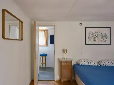 Ein Bett oder Betten in einem Zimmer der Unterkunft Osteria Grütli con alloggio