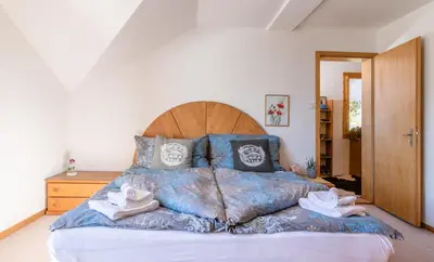 Ein Bett oder Betten in einem Zimmer der Unterkunft Chalet Aargovia