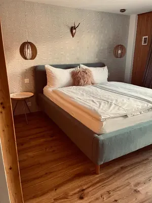 Ein Bett oder Betten in einem Zimmer der Unterkunft Boutique Hotel Bellevue B&B am Brienzersee Iseltwald Interlaken
