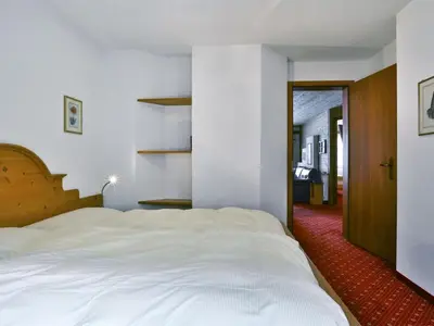 Ein Bett oder Betten in einem Zimmer der Unterkunft Apartment Chalet Abendrot apARTments-32 by Interhome