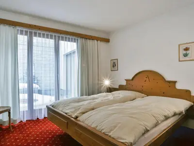 Ein Bett oder Betten in einem Zimmer der Unterkunft Apartment Chalet Abendrot apARTments-32 by Interhome