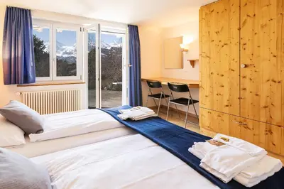 Ein Bett oder Betten in einem Zimmer der Unterkunft Chalet Steingärtli 1