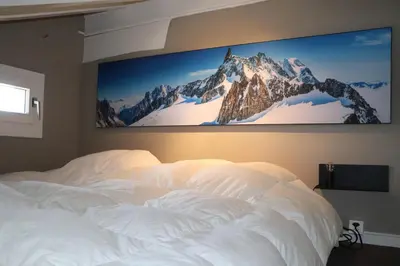 Ein Bett oder Betten in einem Zimmer der Unterkunft Mitenand Attika