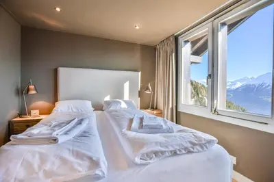 Ein Bett oder Betten in einem Zimmer der Unterkunft Mitenand Attika