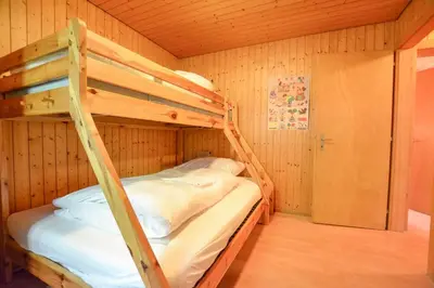 Ein Bett oder Betten in einem Zimmer der Unterkunft Chalet Castellani Apartment